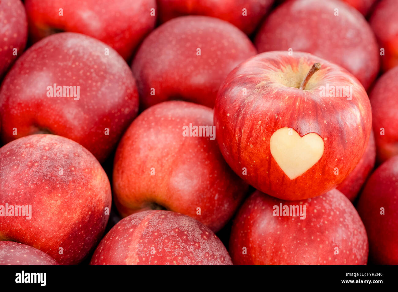 Apple with a heart shape cut-out Stock Photo