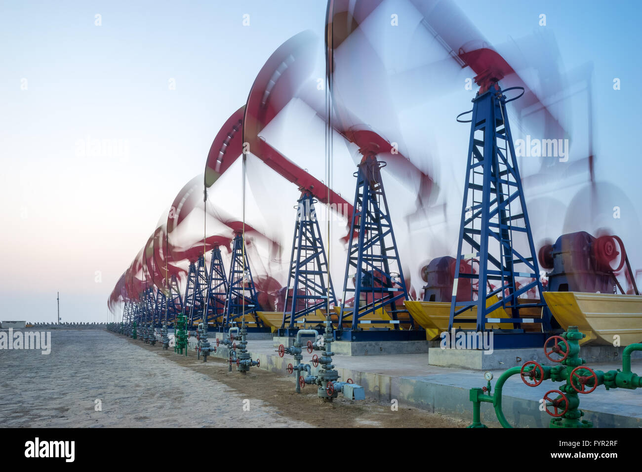 working oil-rig in oilfield in clear sky Stock Photo - Alamy