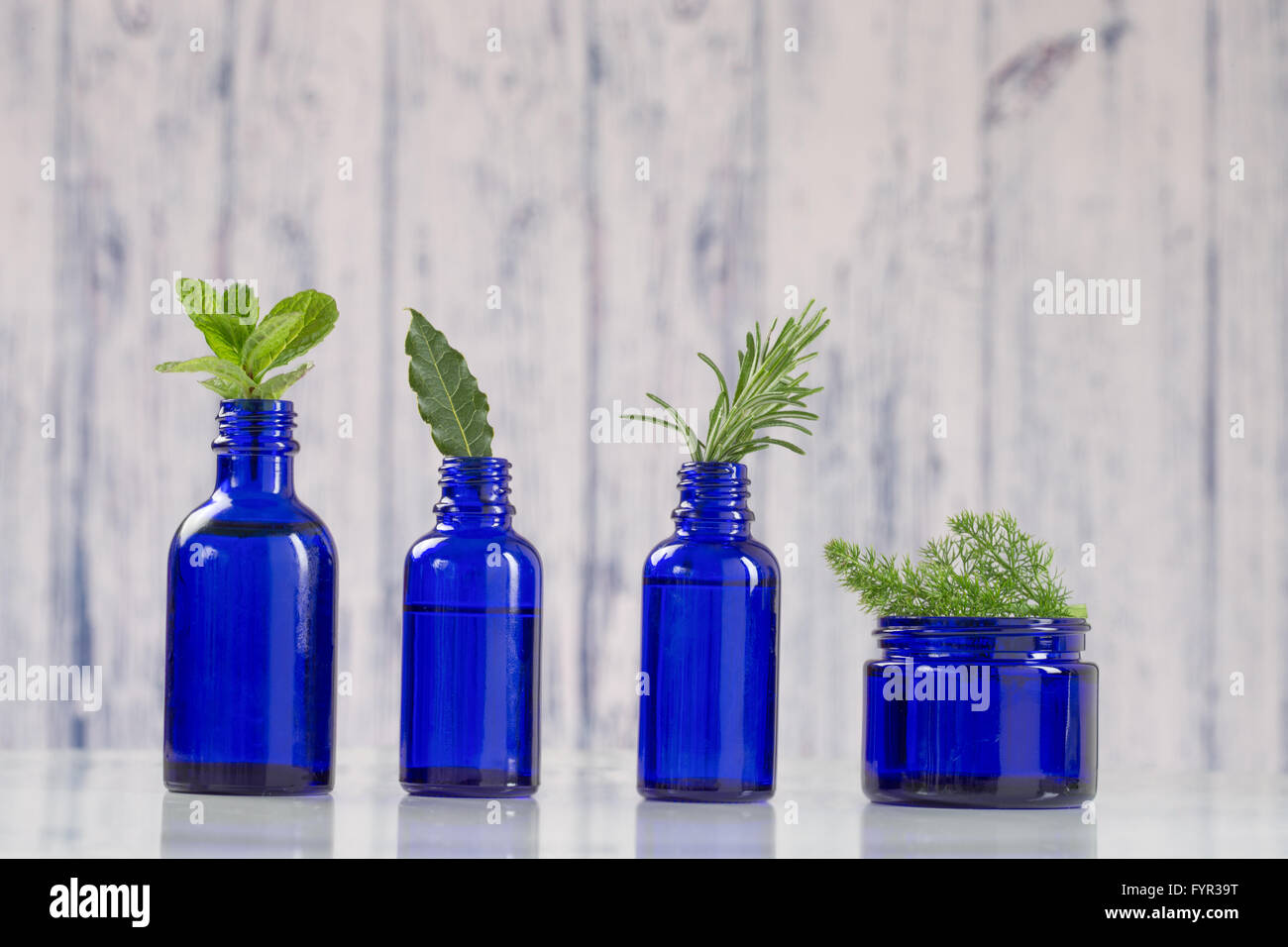 Various Aromatic essential oil  in blue bottle Stock Photo