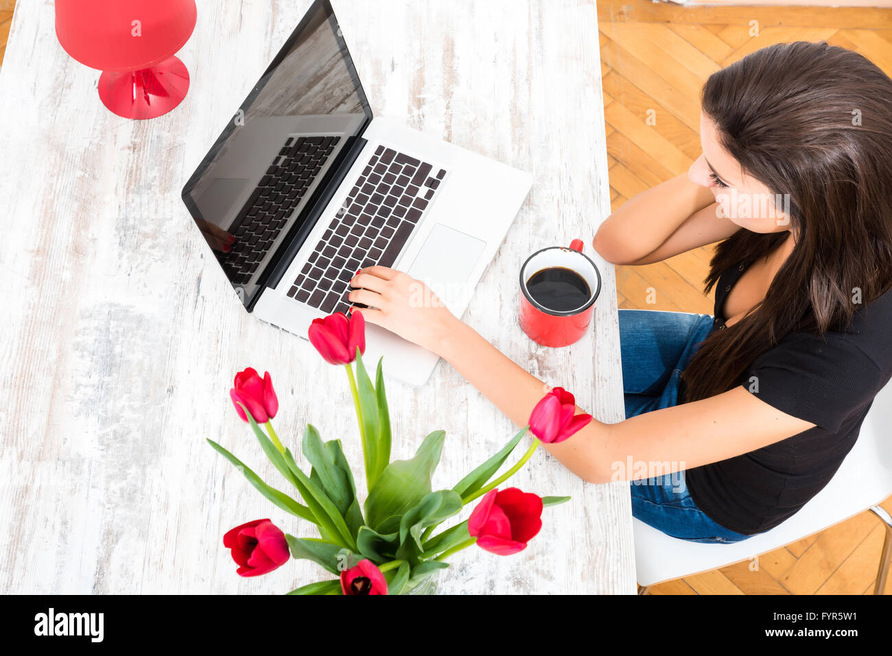 Young beautiful woman using a Laptop at home Stock Photo - Alamy