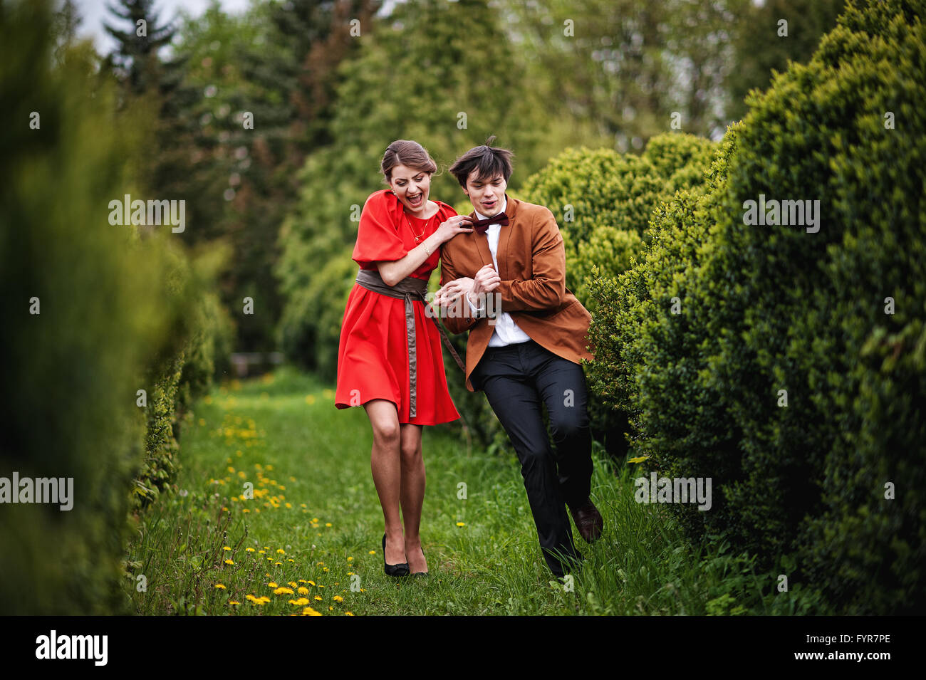 Young beautiful couple in the park Stock Photo - Alamy