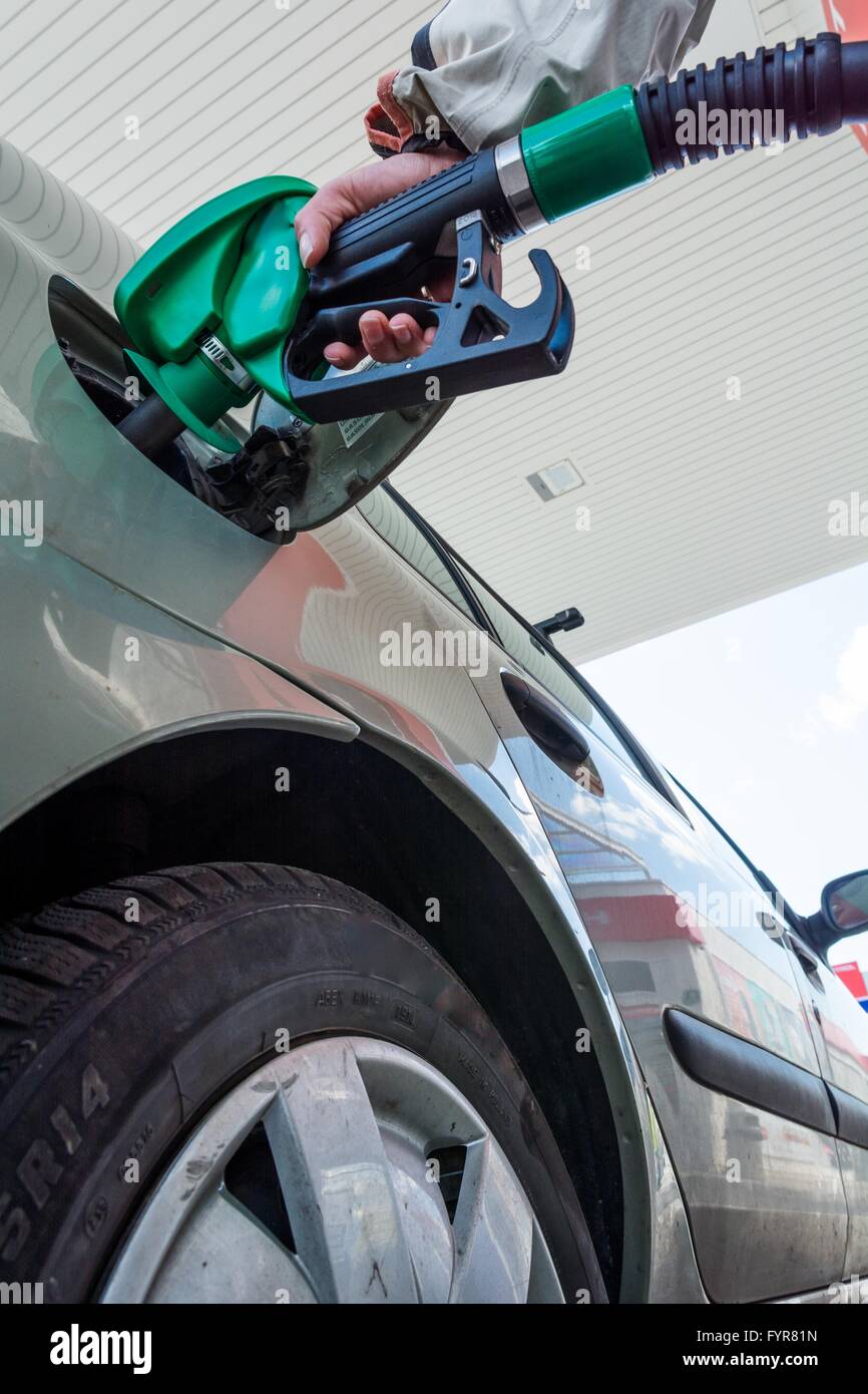 Pumping gas. Hand holding fuel nozzle Stock Photo Alamy
