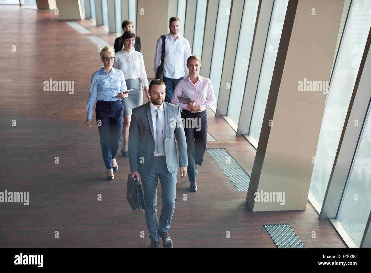 business people group walking Stock Photo - Alamy
