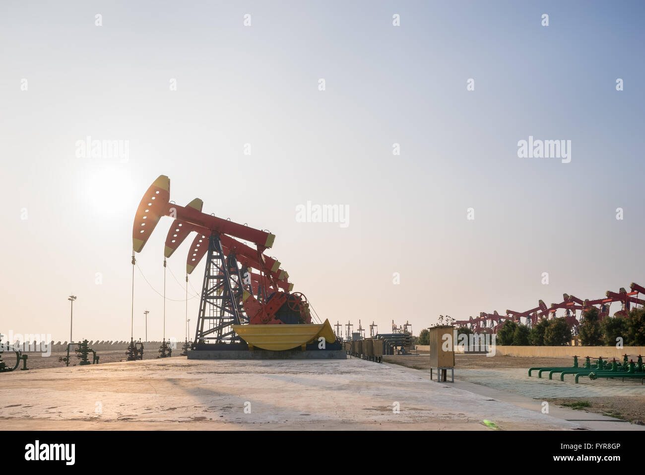 working oil-rig in oilfield in clear sky Stock Photo - Alamy