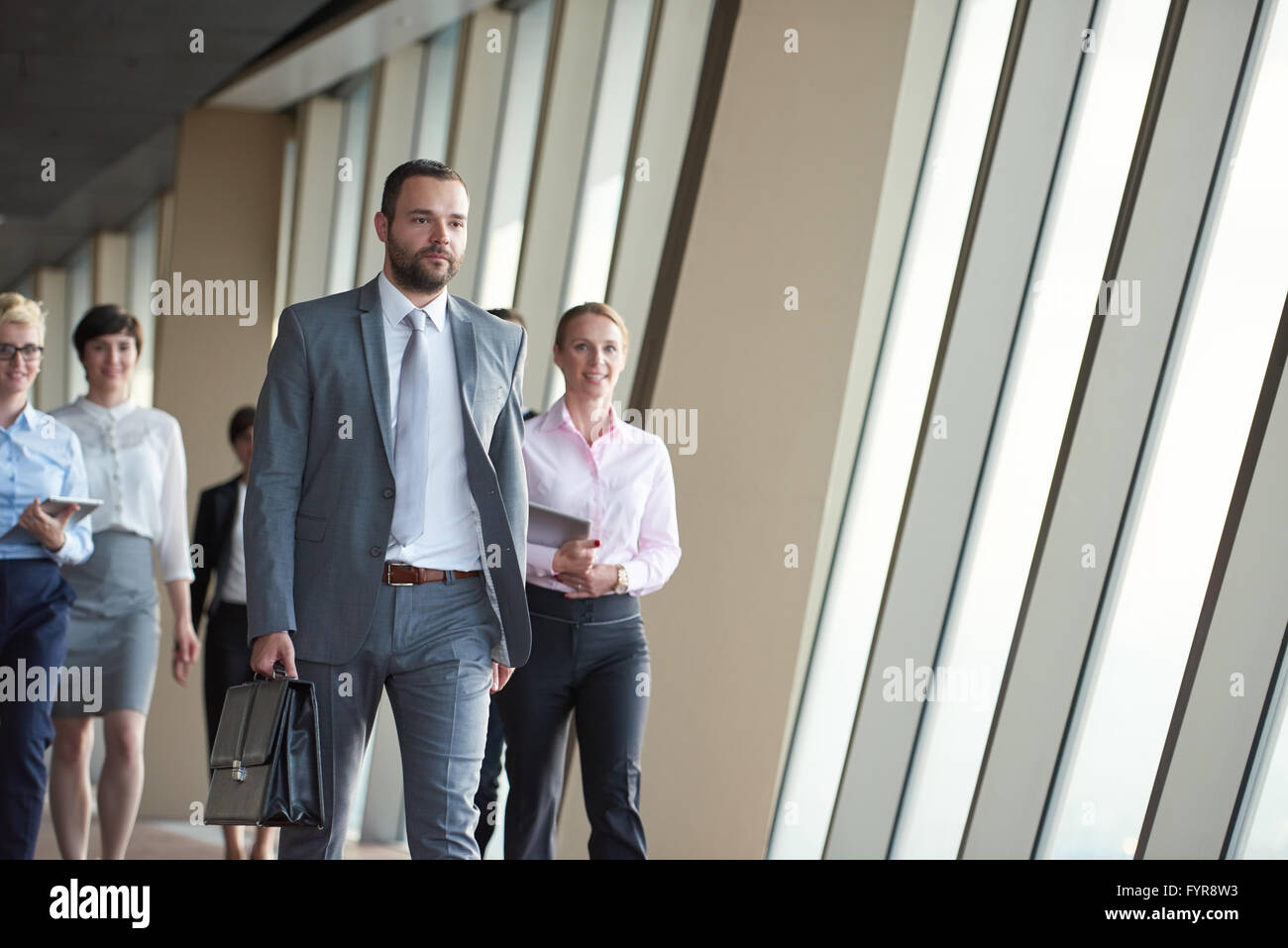 business people group walking Stock Photo - Alamy