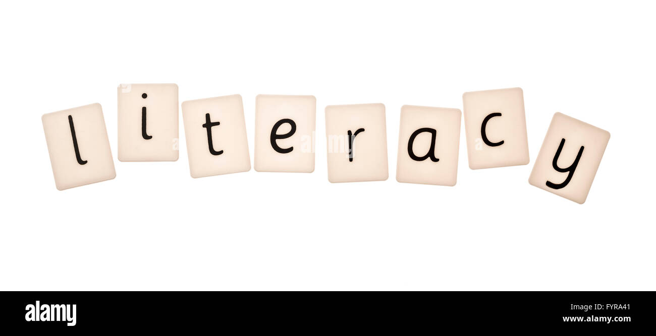 Plastic letters on white background spelling the word lteracy Stock Photo