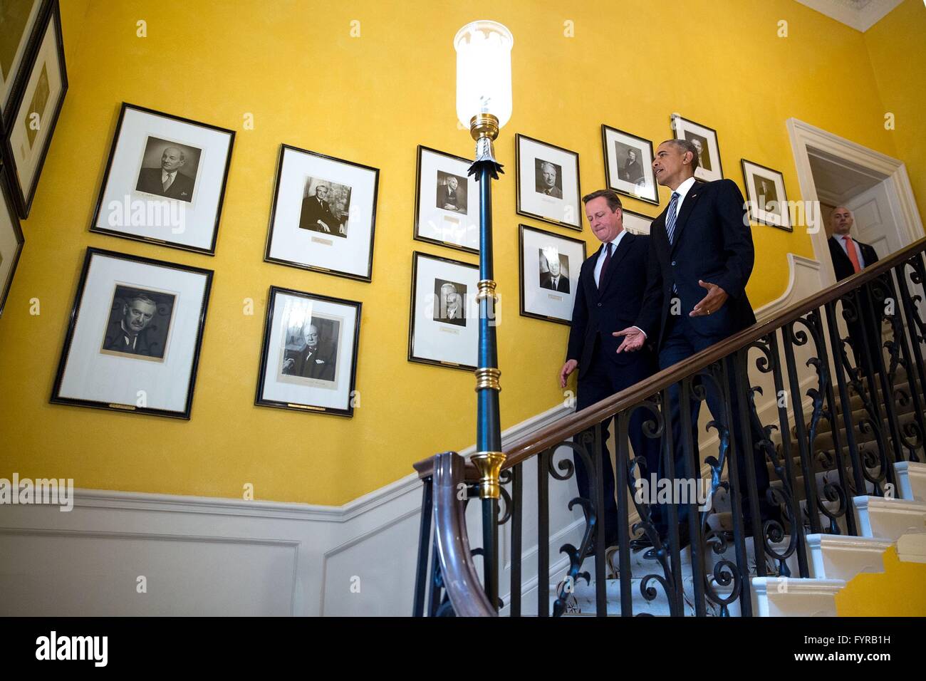U.S President Barack Obama and British Prime Minister David Cameron walks down the staircase inside Number 10 Downing Street April 22, 2016 in London, United Kingdom. Stock Photo