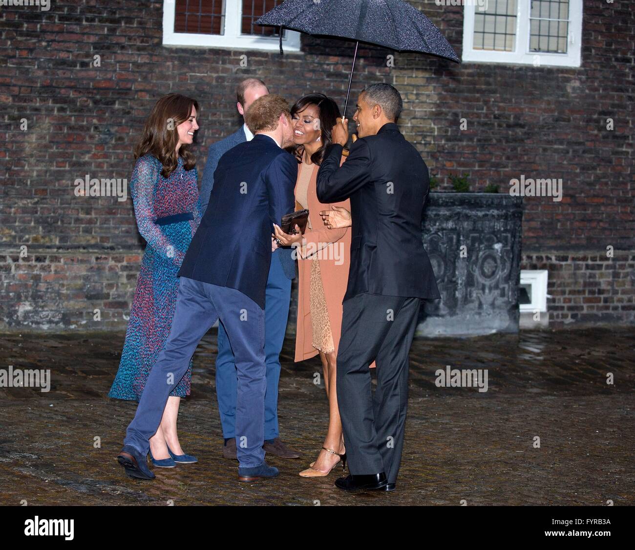 U.S President Barack Obama and First Lady Michelle Obama are greeted by Prince Harry of Wales, Prince William, the Duke of Cambridge and Kate Middleton, Duchess of Cambridge on arrival for dinner at Kensington Palace April 22, 2016 in London, United Kingdom. Stock Photo