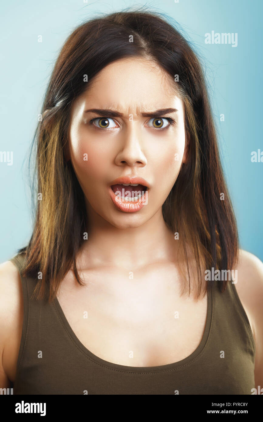 Face of shocked surprised young woman Stock Photo