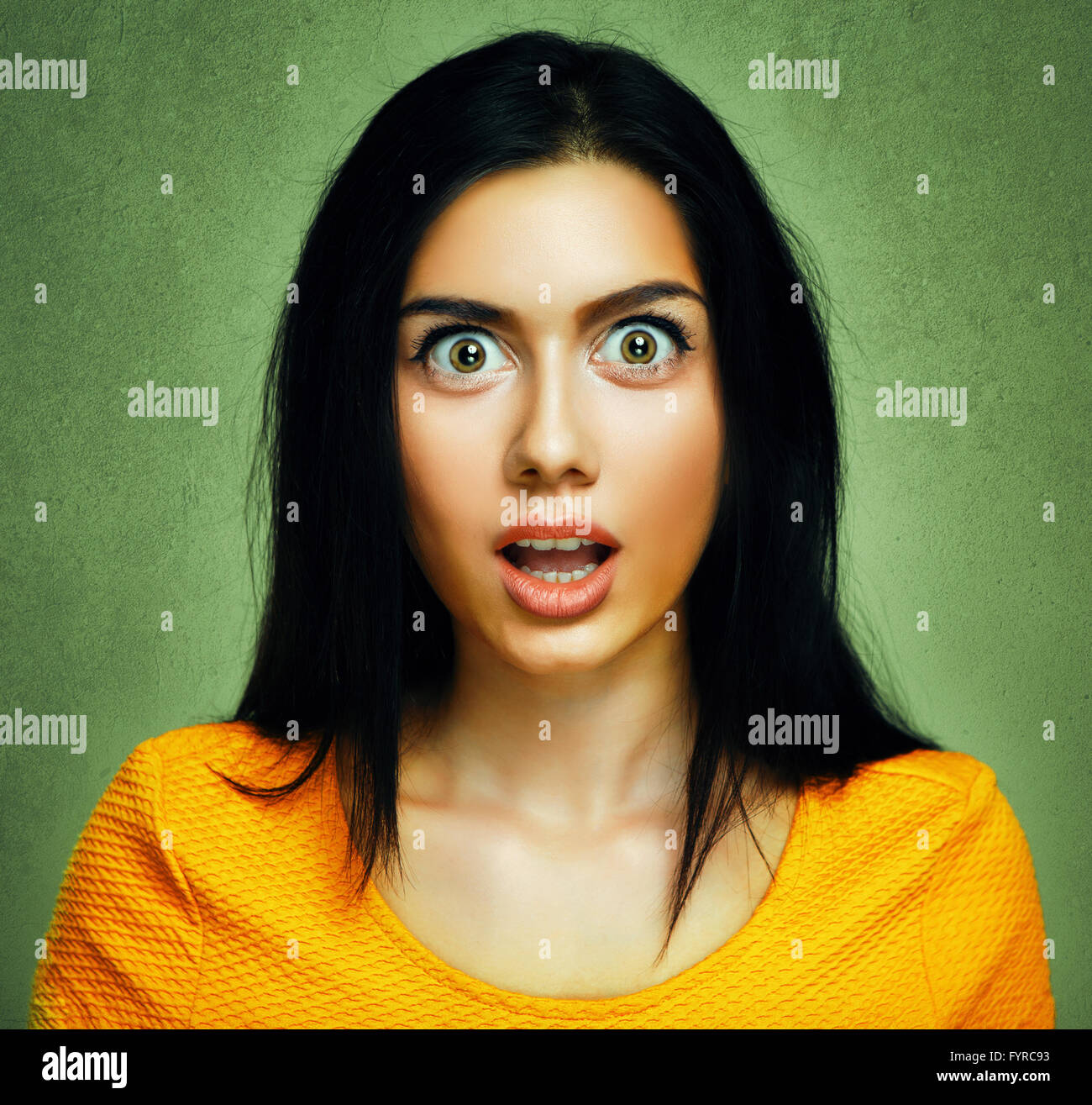 Surprised face of amazed shocked young woman Stock Photo