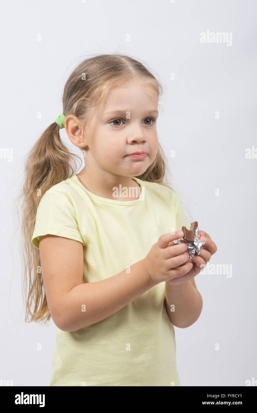 Portrait of a four-year girl with chocolate in hand Stock Photo