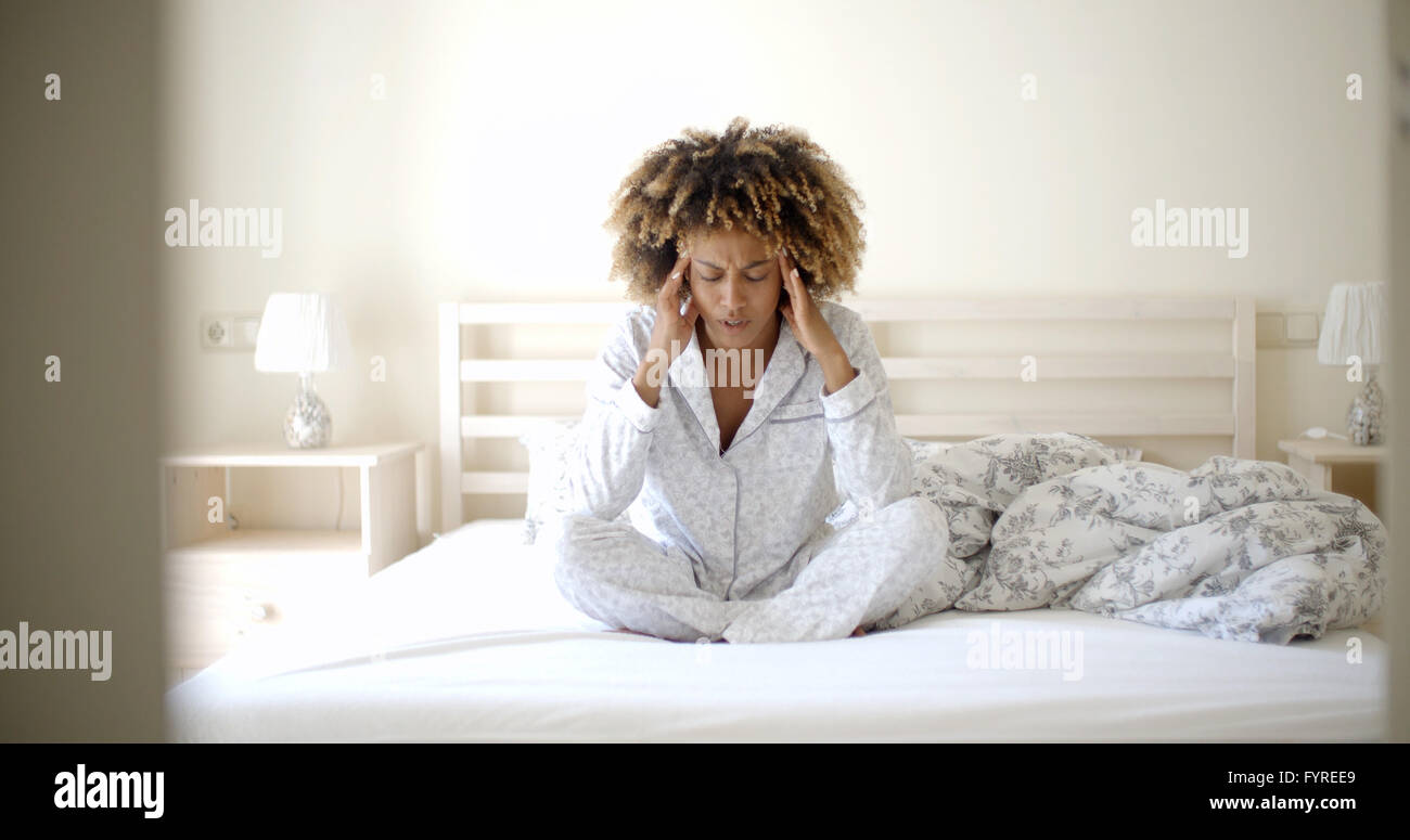 Depressed Woman On The Bed Stock Photo