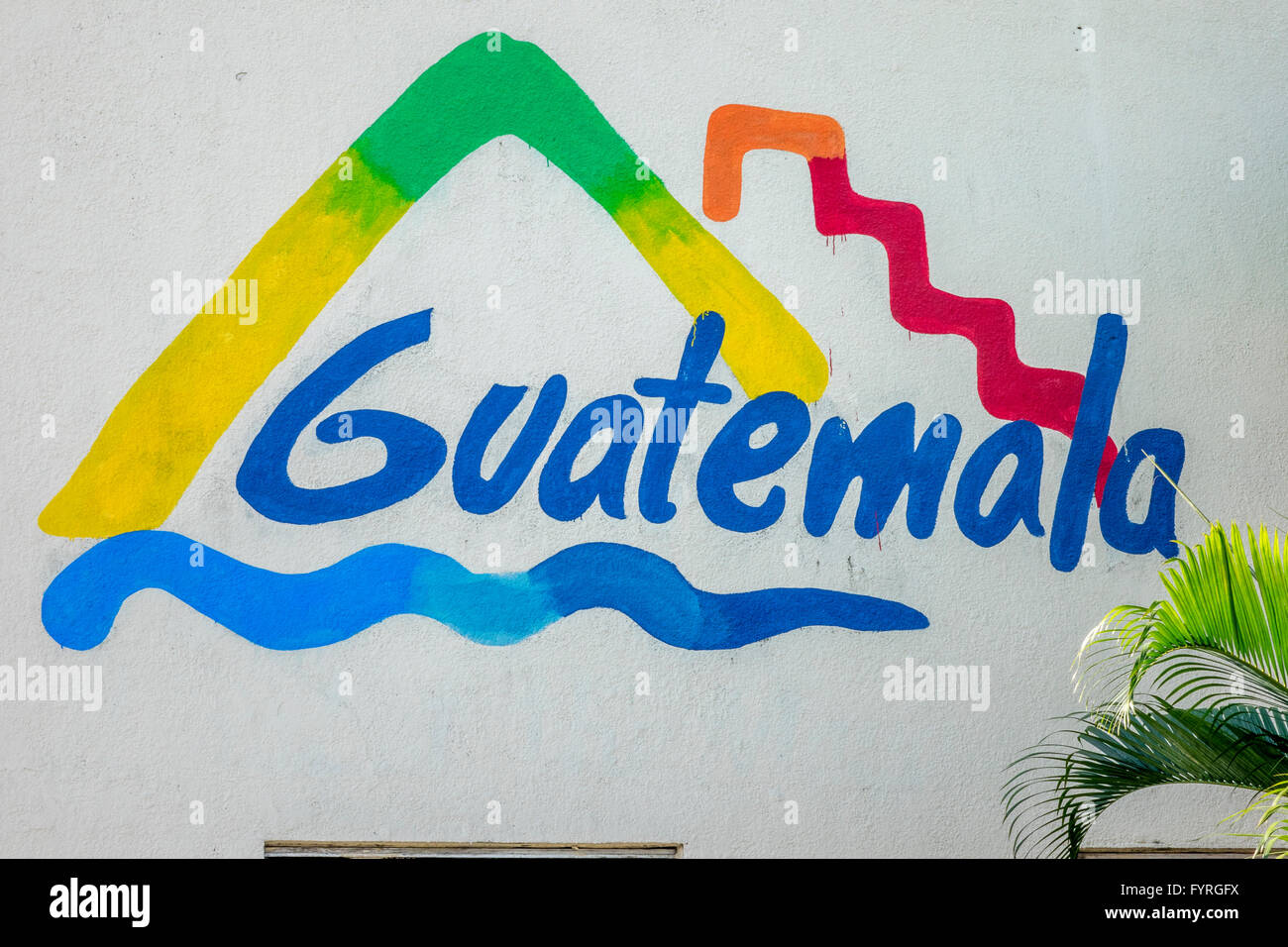 The Guatemalan Tourism Logo Sign Painted On The Wall Of The Cruise Ship Welcome Centre In Santo Tomas de Castilla Guatemala Stock Photo