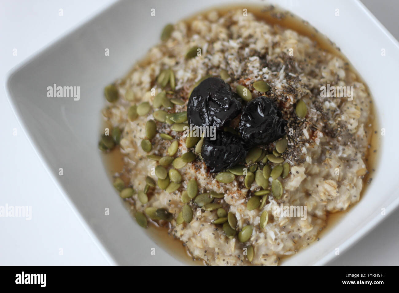 A bowl of oatmeal cereal Stock Photo