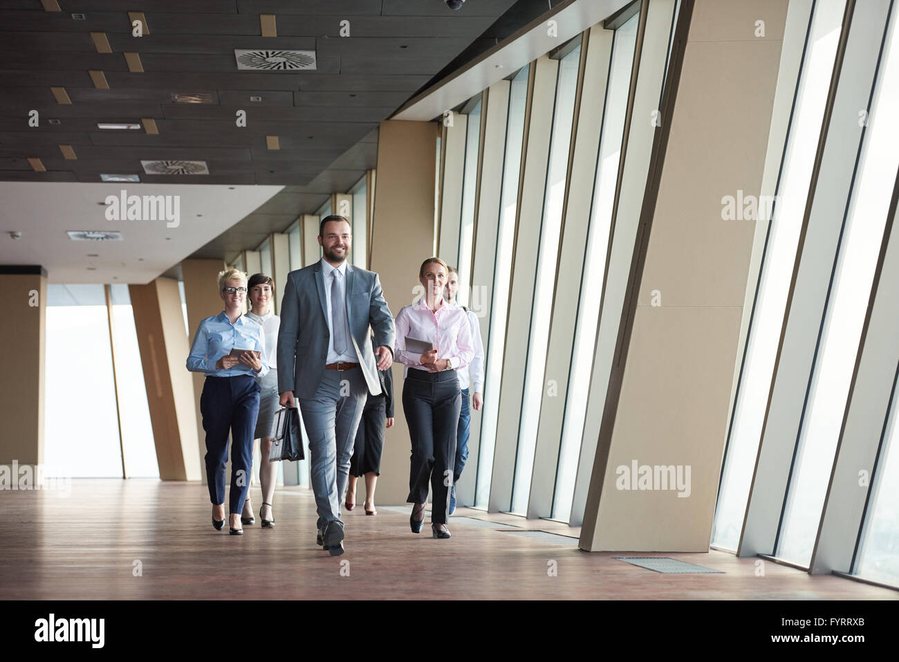 business people group walking Stock Photo - Alamy