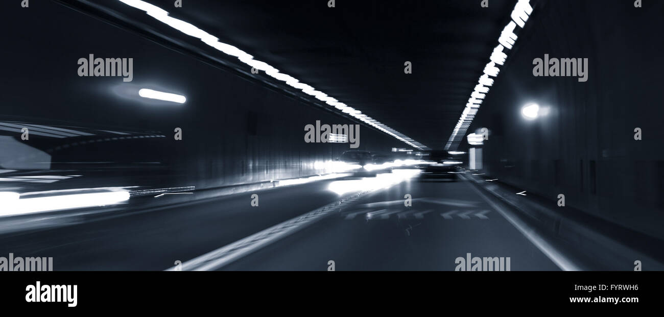 Road tunnel with oncoming traffic Stock Photo