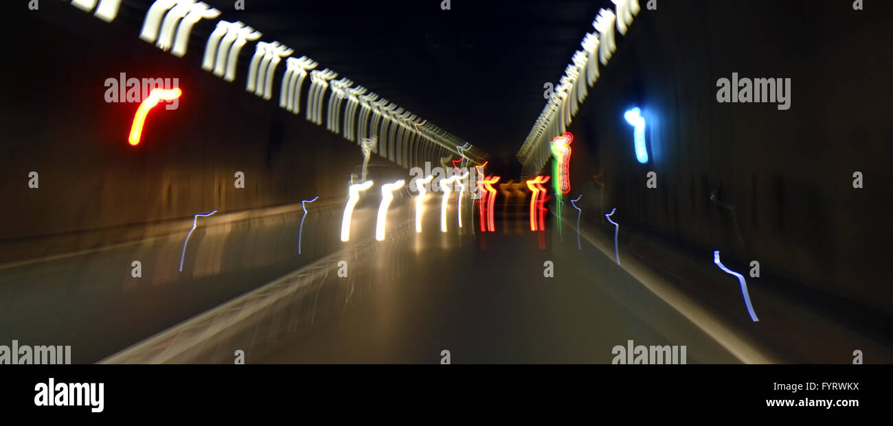 Oncoming traffic in a road tunnel Stock Photo