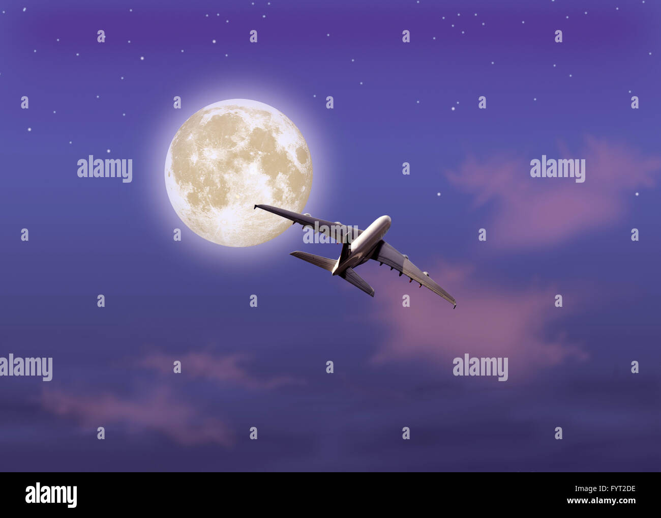 Airplane in the night sky Stock Photo