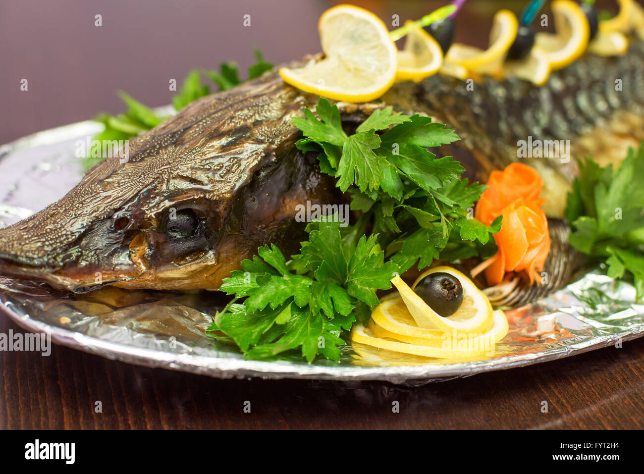 sturgeon baked with greens Stock Photo