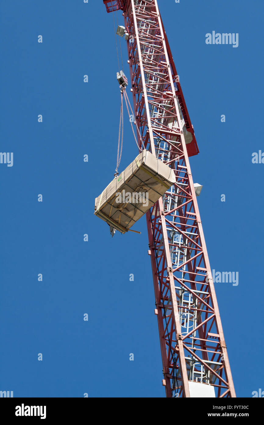 material loaded with a crane on a construction site Stock Photo