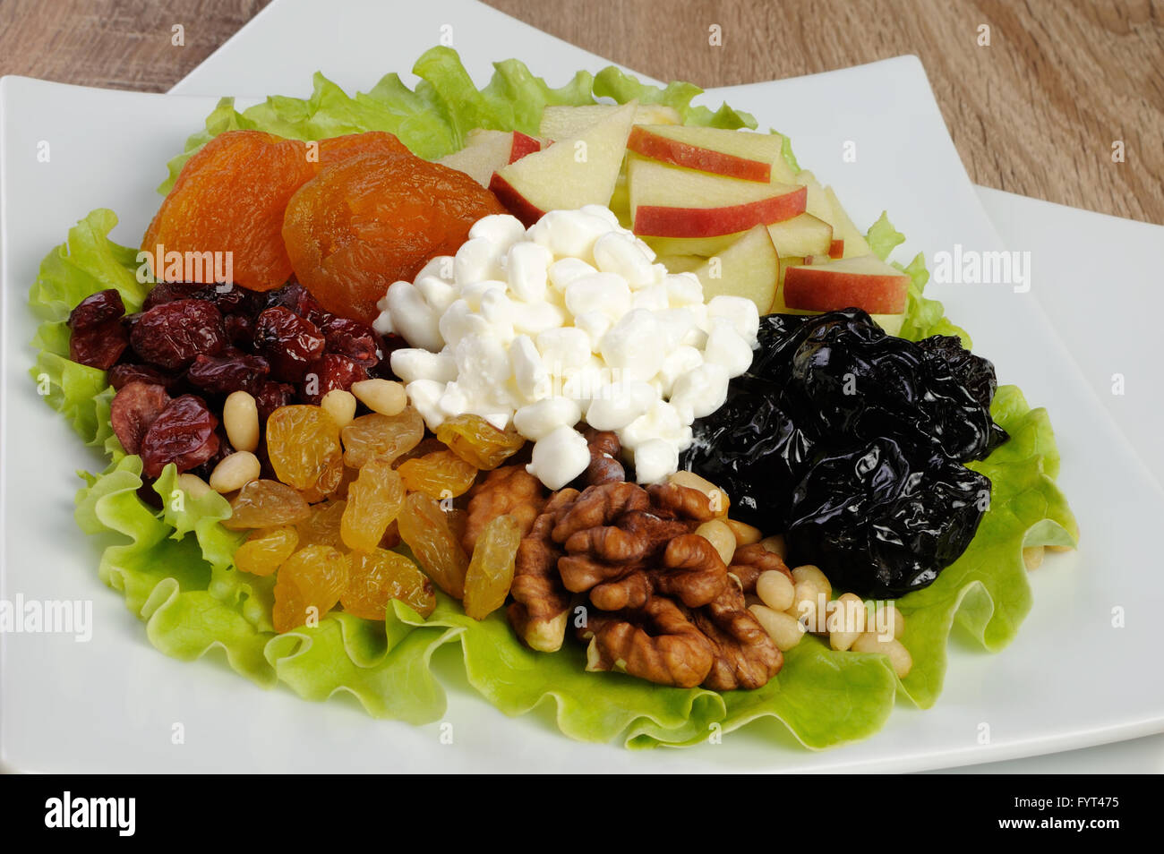 Vitamin Salad With Nuts Apples Dried Fruit And Cottage Cheese In