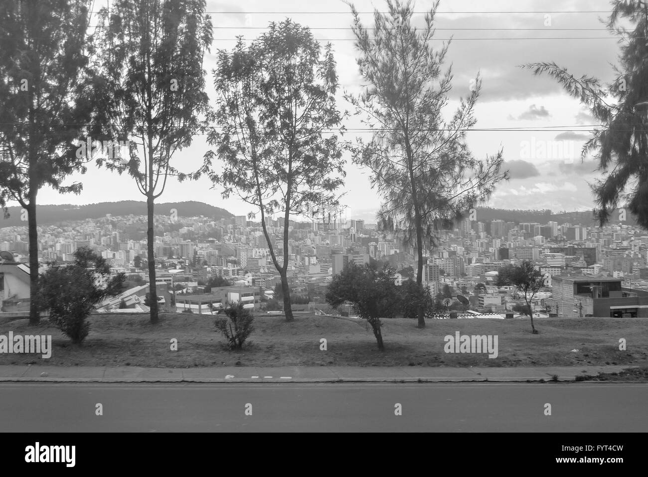 Avenue and houses on hill cityscape view in the city of Quito, Ecuador