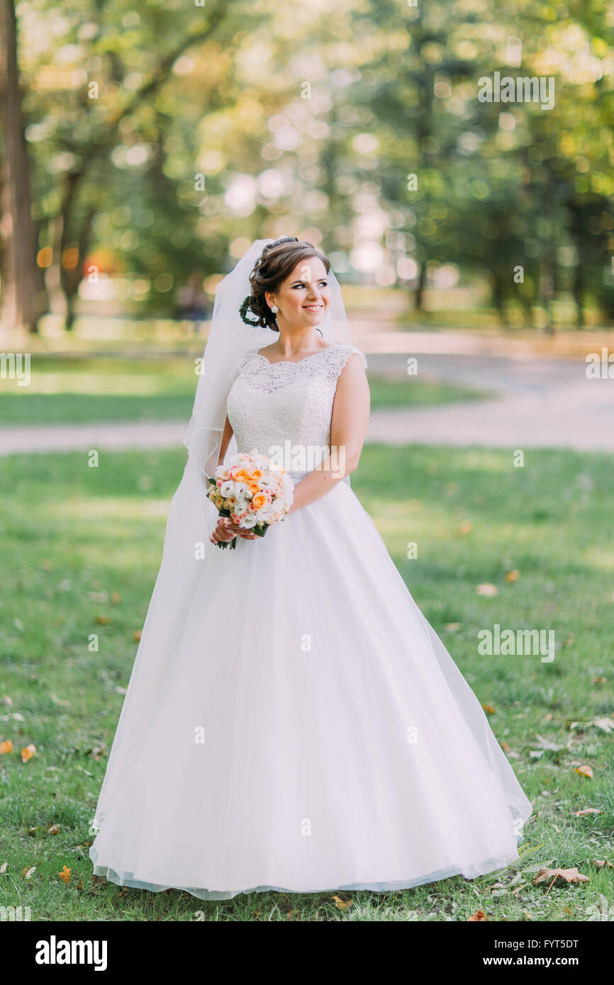 Bride alone happy outdoors hi-res stock photography and images - Alamy