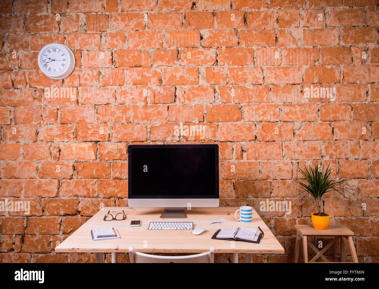 Desk with various gadgets and office supplies. Studio shot Stock Photo