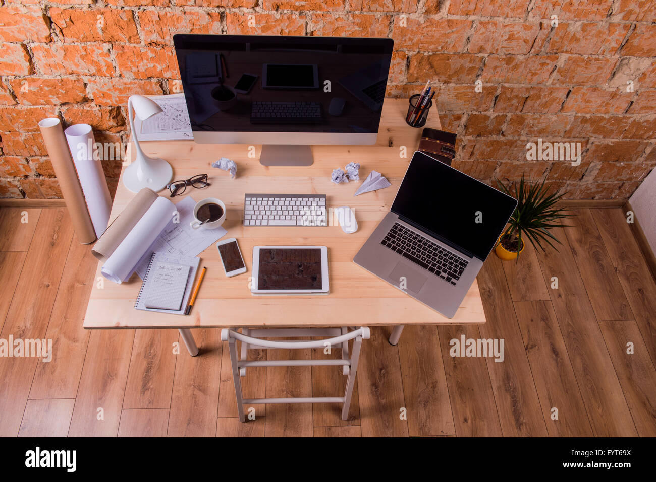 Desk with various gadgets and office supplies. Studio shot Stock Photo