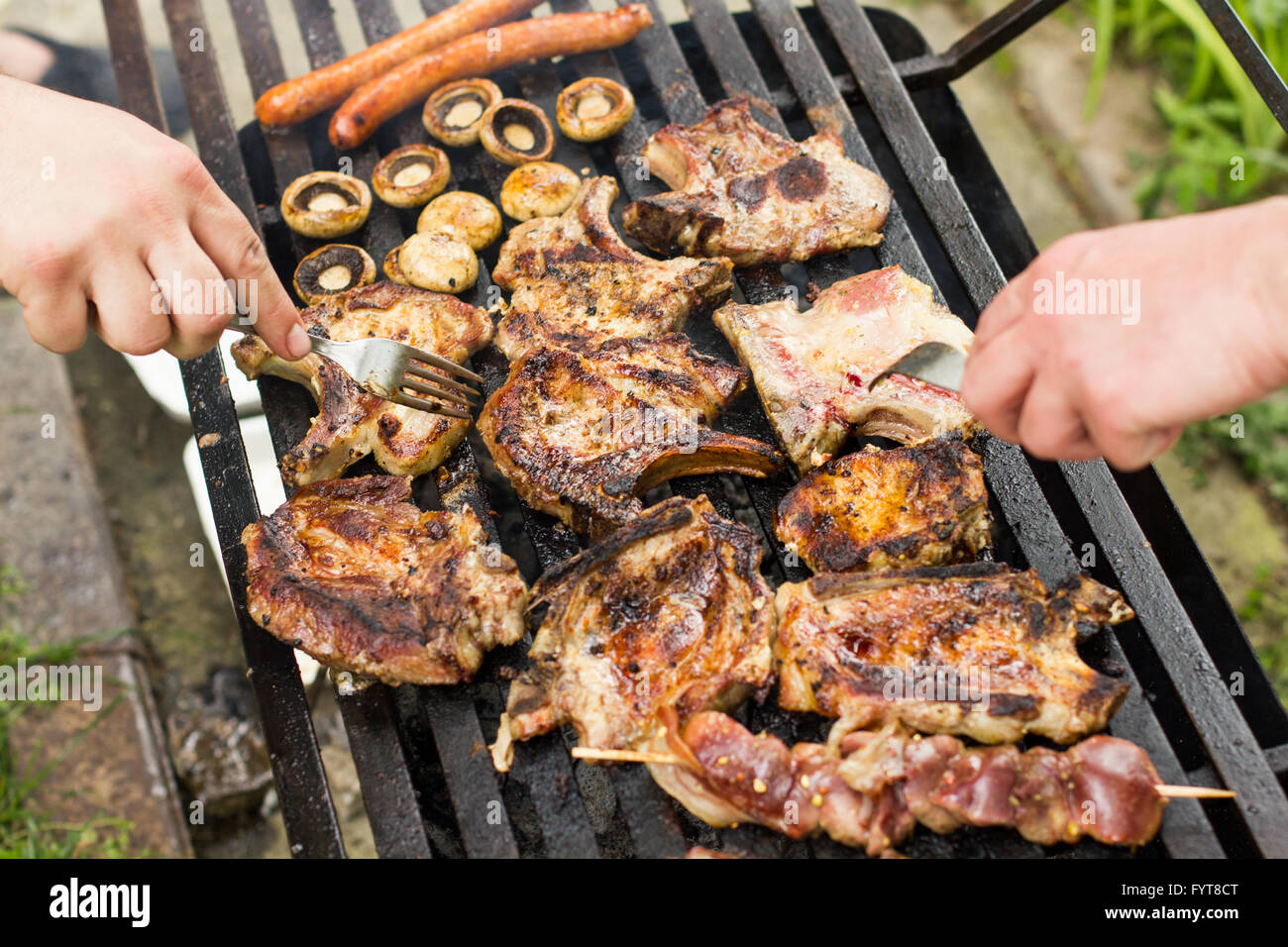 Grilled meat on the barbecue,cooked outdoor Stock Photo - Alamy