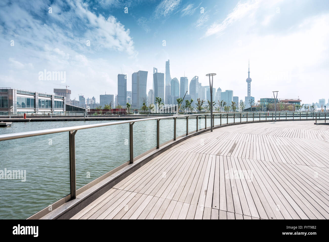 empty wooden road waterside and modern buildings Stock Photo - Alamy