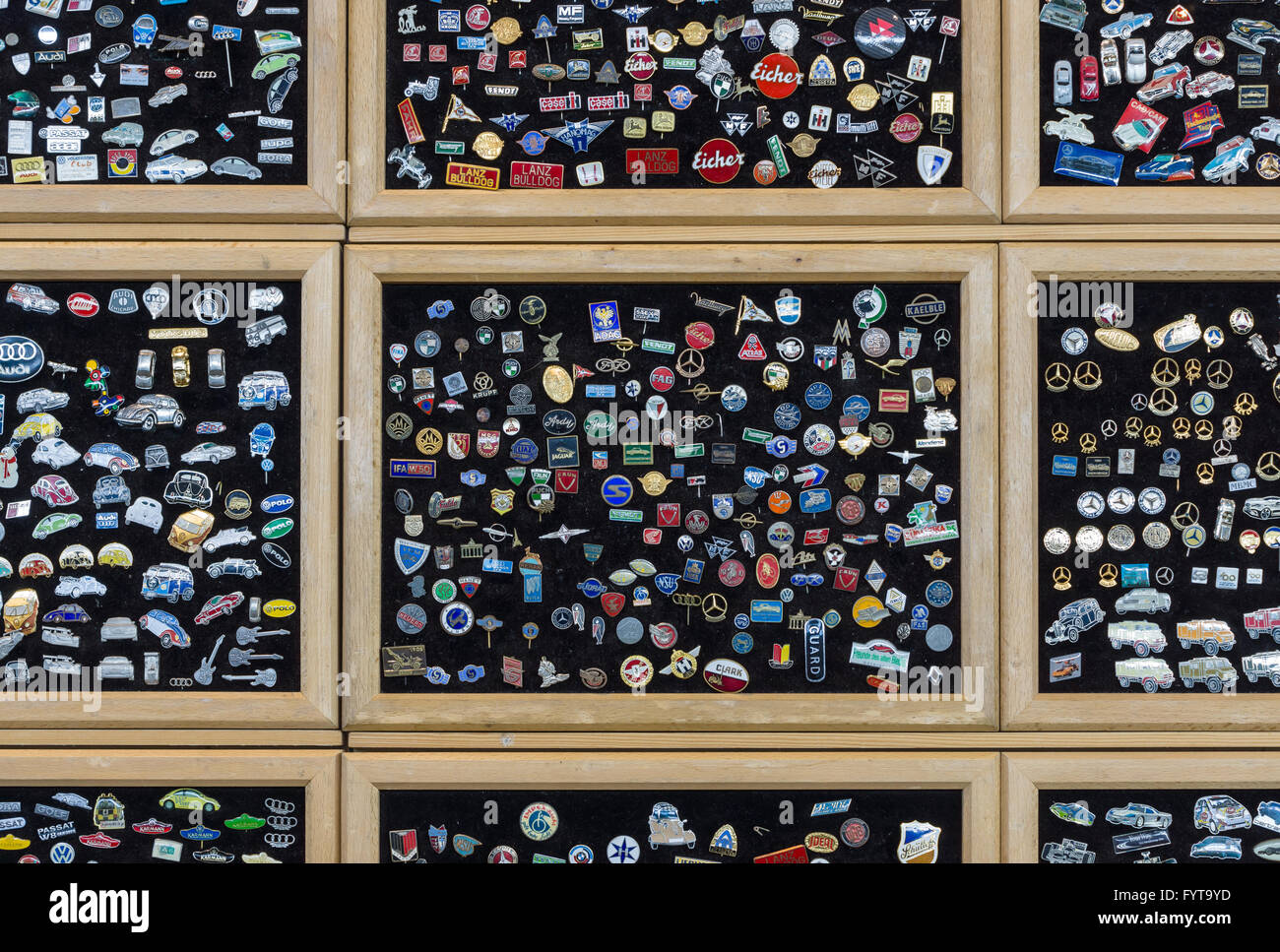 Background of lapel pins with the logos of wellknown automobile firms