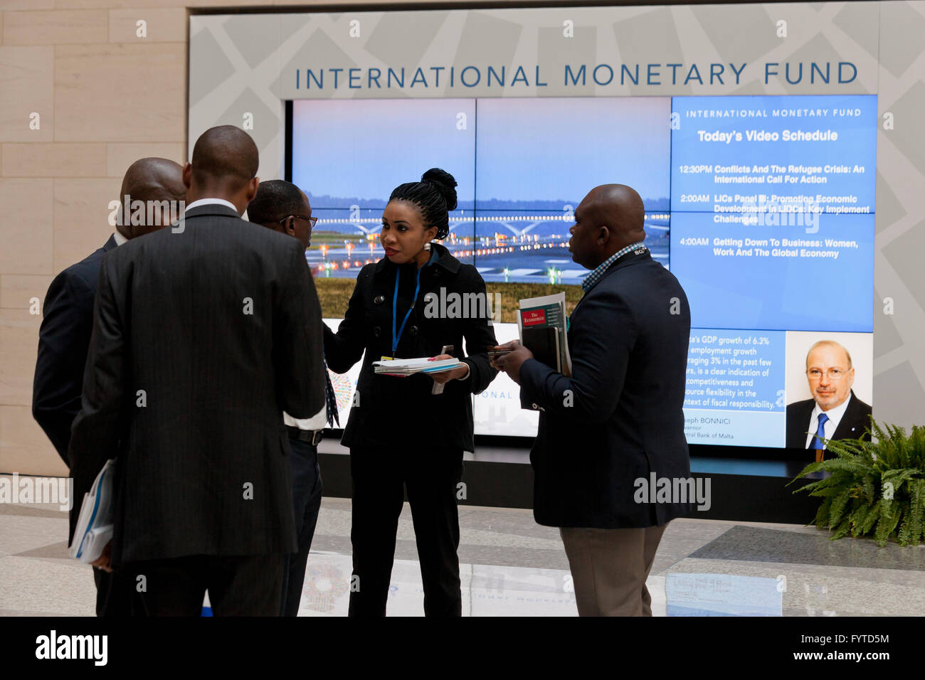 African delegation members having a business meeting  in the lobby of the IMF headquarters building - Washington, DC USA Stock Photo