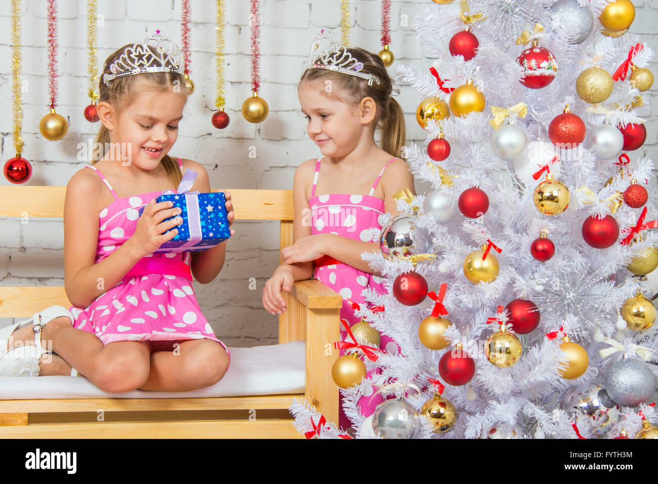 The girl gave another girl New Years gift Stock Photo