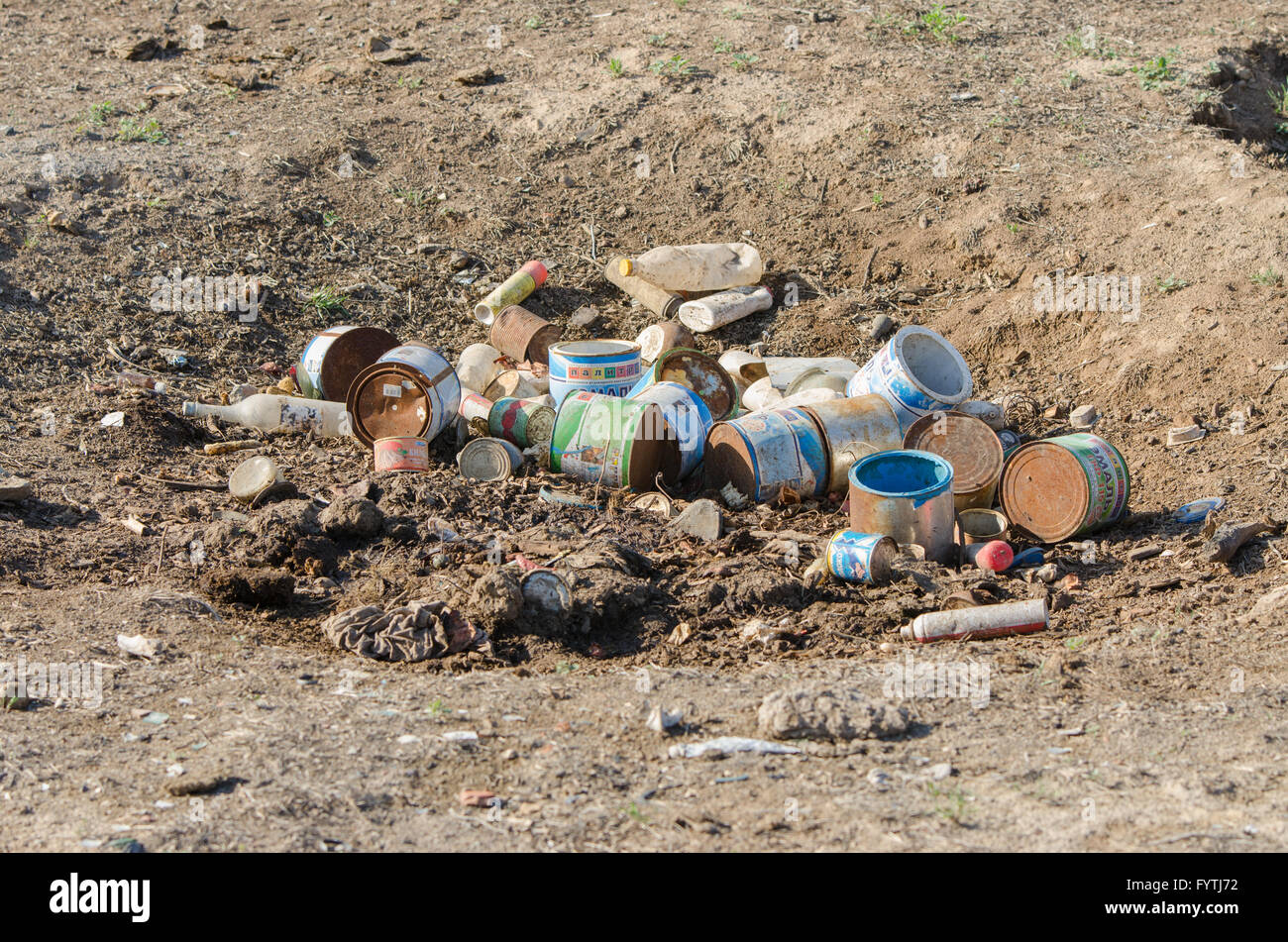 A pile of construction waste lies in an earthen pit Stock Photo