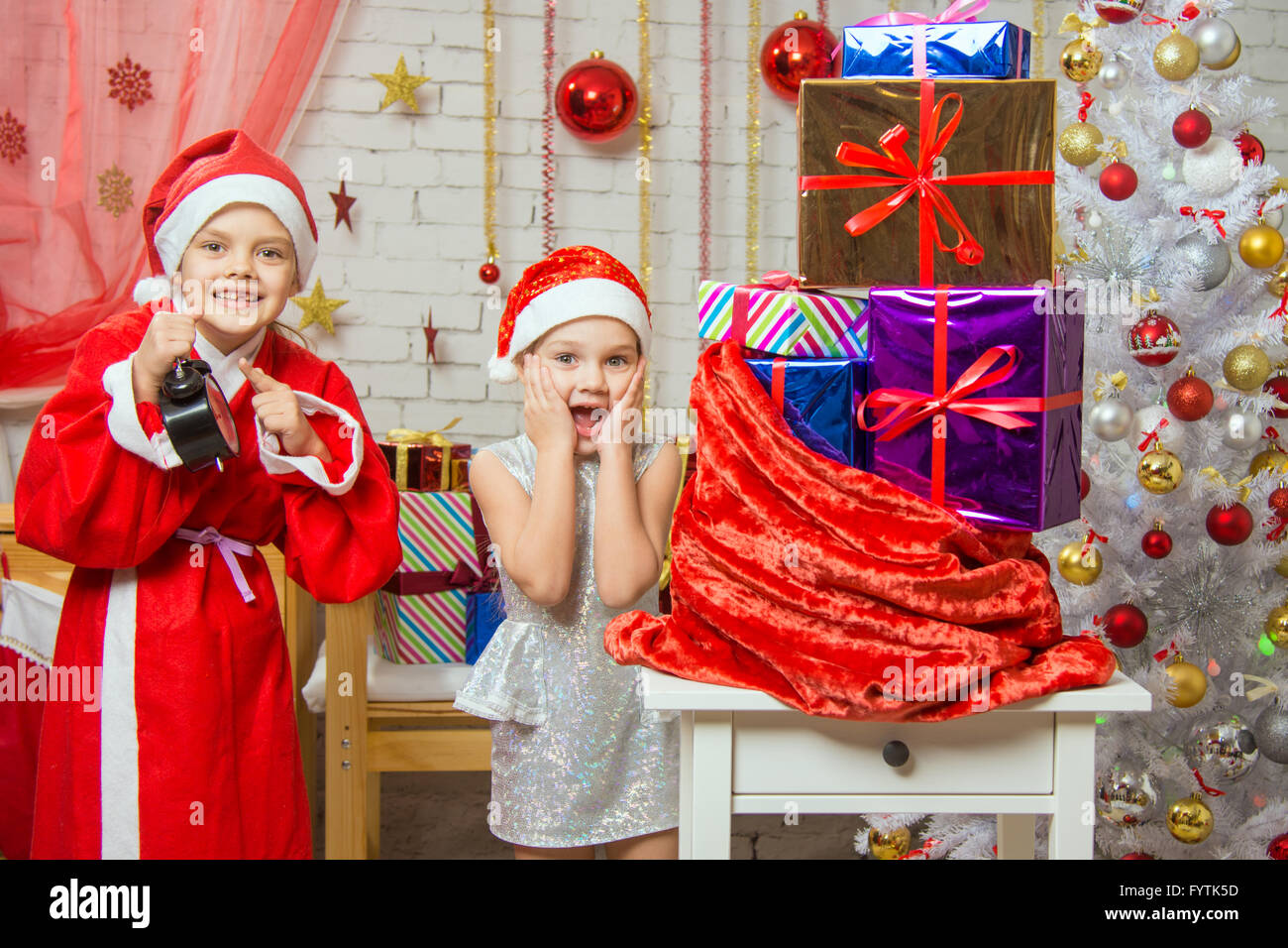 Santa Claus showed the clock Assistant, all the fun smile Stock Photo