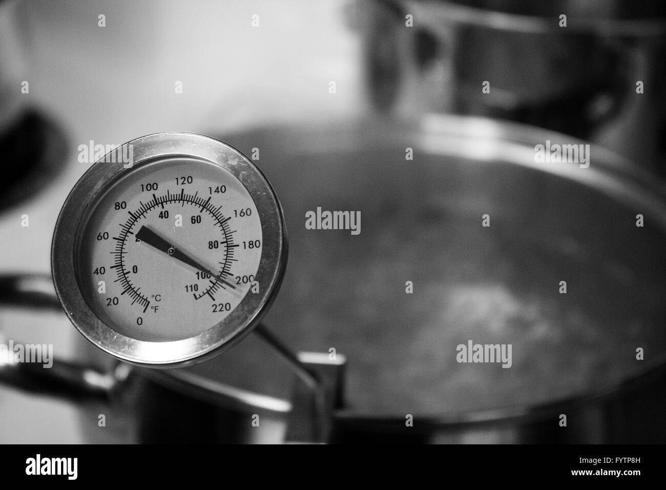 Boiling Water in Pot with Thermometer in Black and White. Part of Home Brewing Series Stock