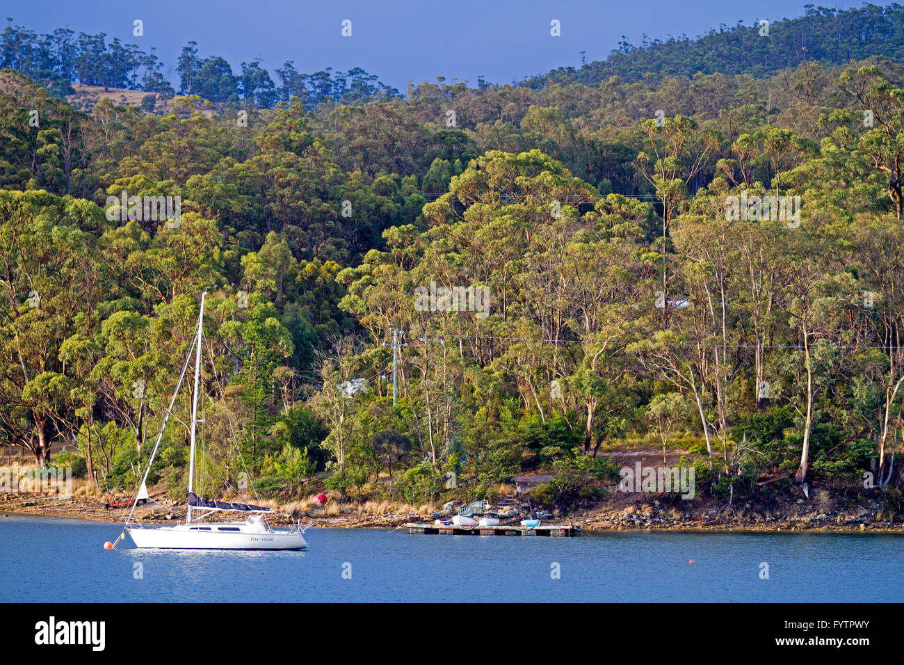 Yacht moored off Bruny Island Stock Photo