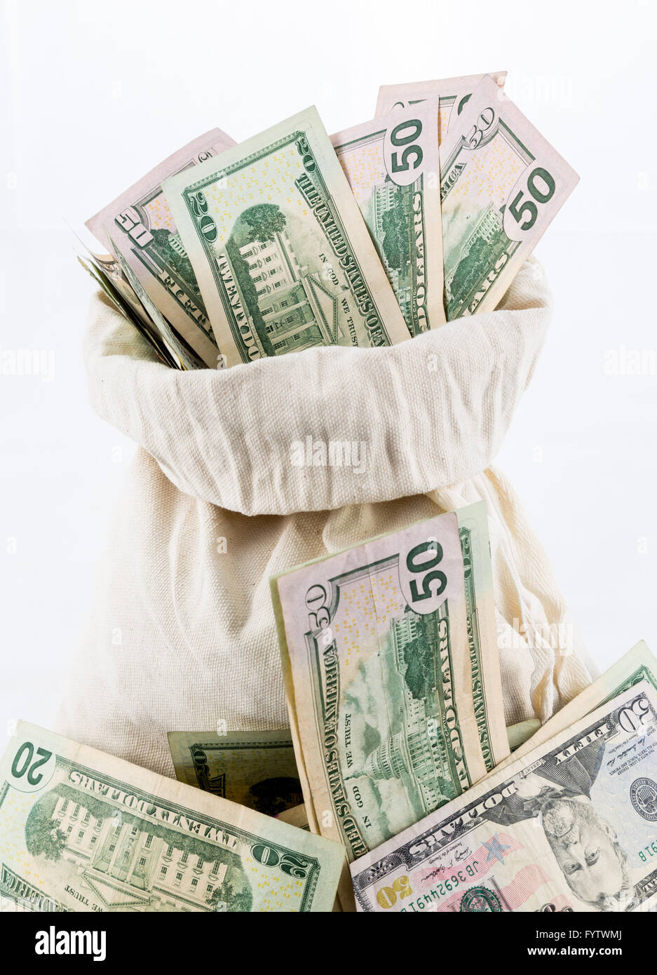 Many US dollar bills or notes with money bags Stock Photo Alamy