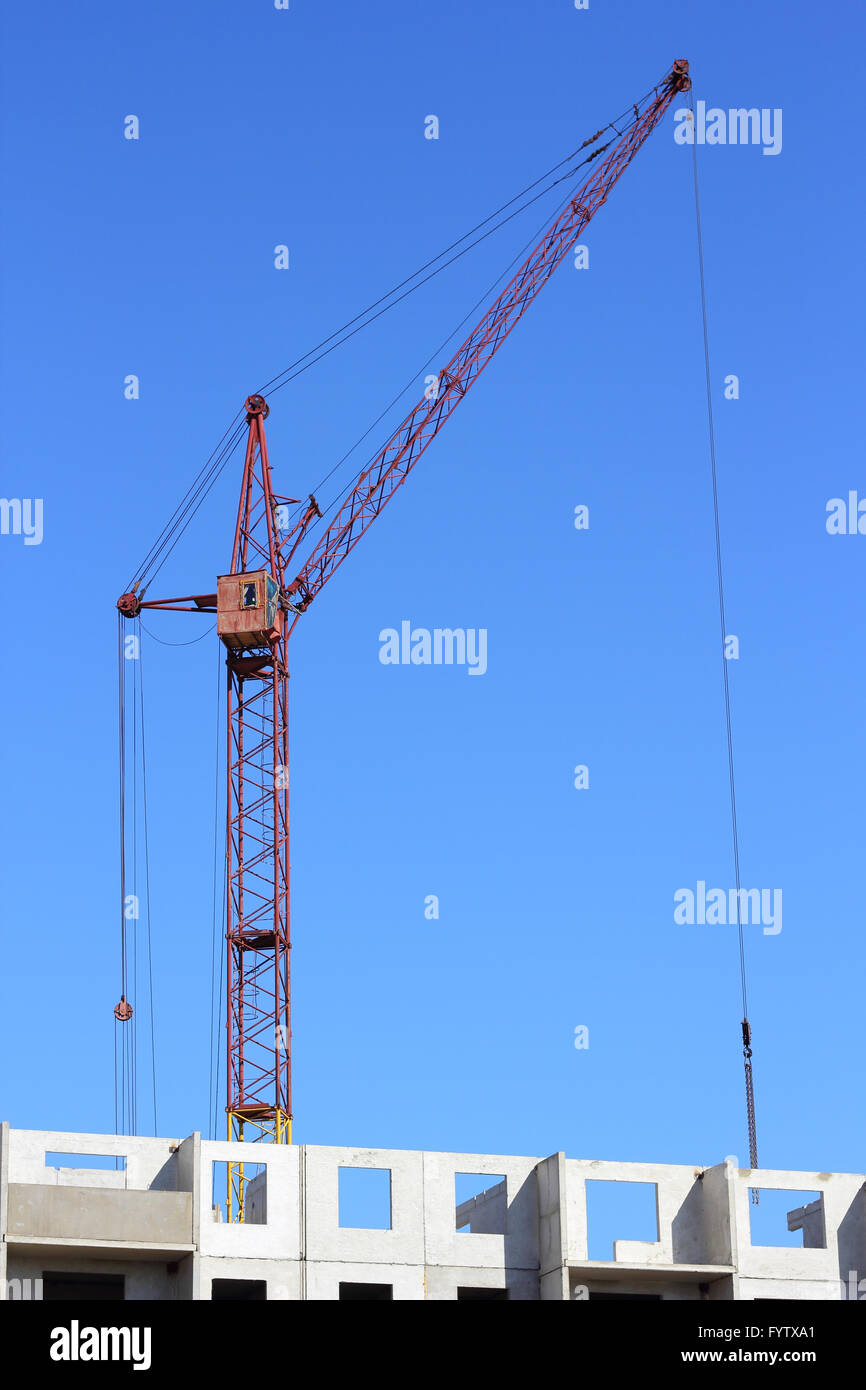 Industrial landscape with silhouettes of cranes on the sky background Stock Photo