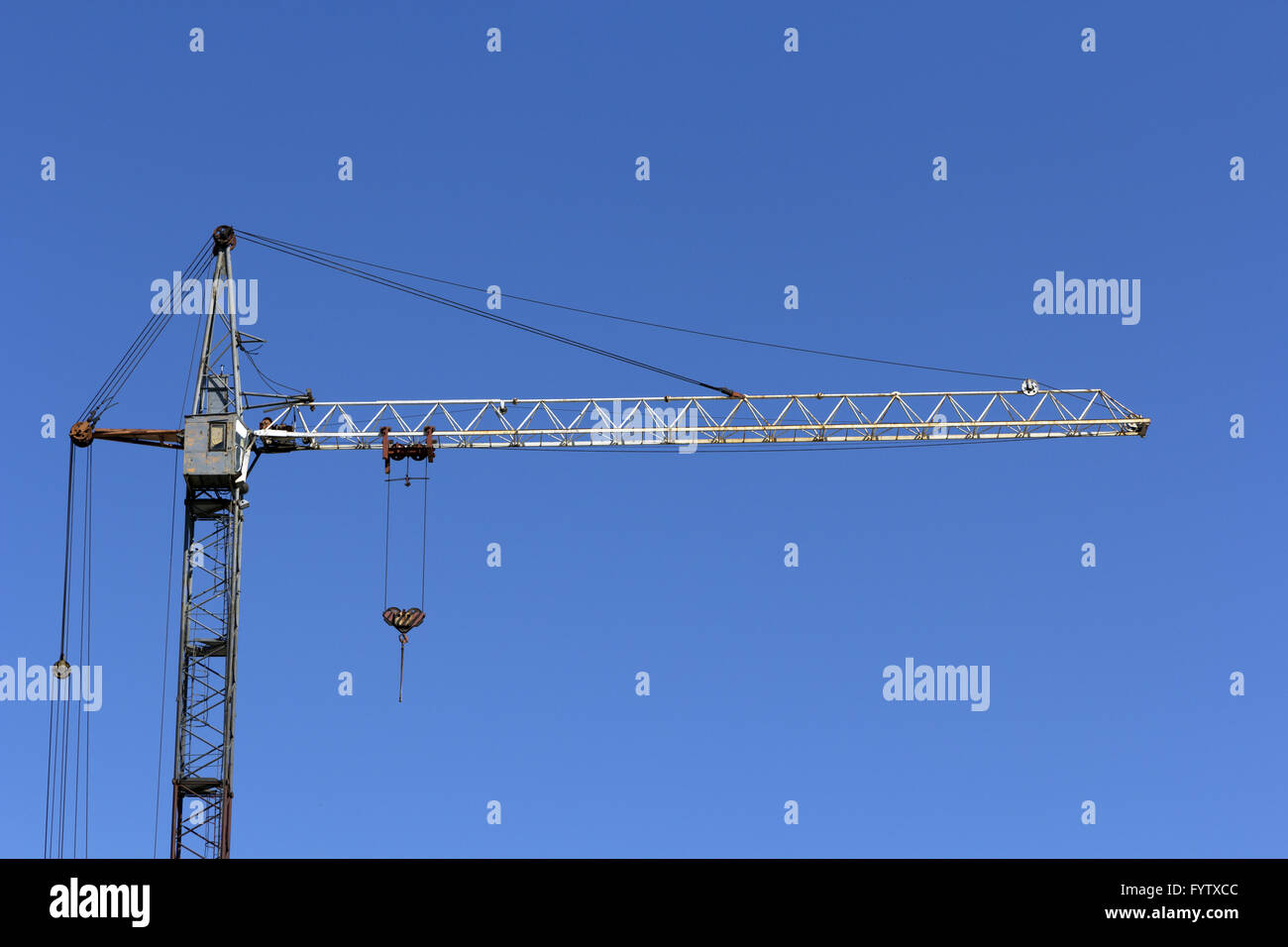 Industrial landscape, building crane against the blue sky Stock Photo