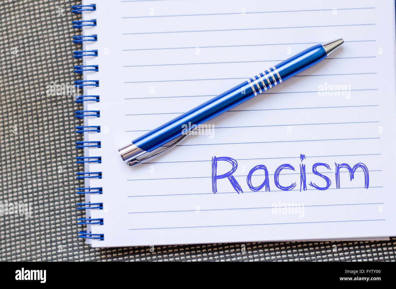 Racism write on notebook Stock Photo Alamy