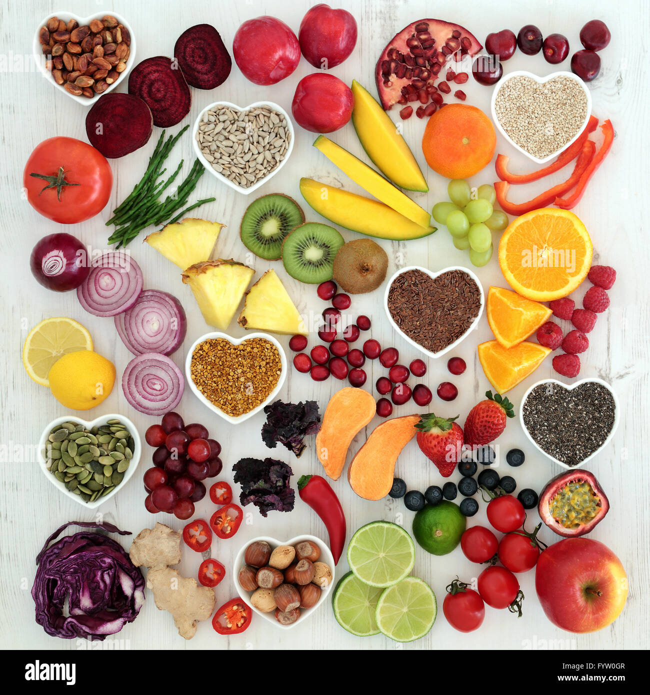 Paleolithic diet health and super food of fruit, vegetables, nuts and seeds on distressed white