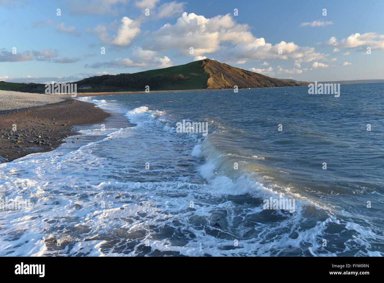 Tanybwlch Beach looking south in Cardigan Bay West Wales, with waves crashing on the beach with blue sky and clouds. Stock Photo