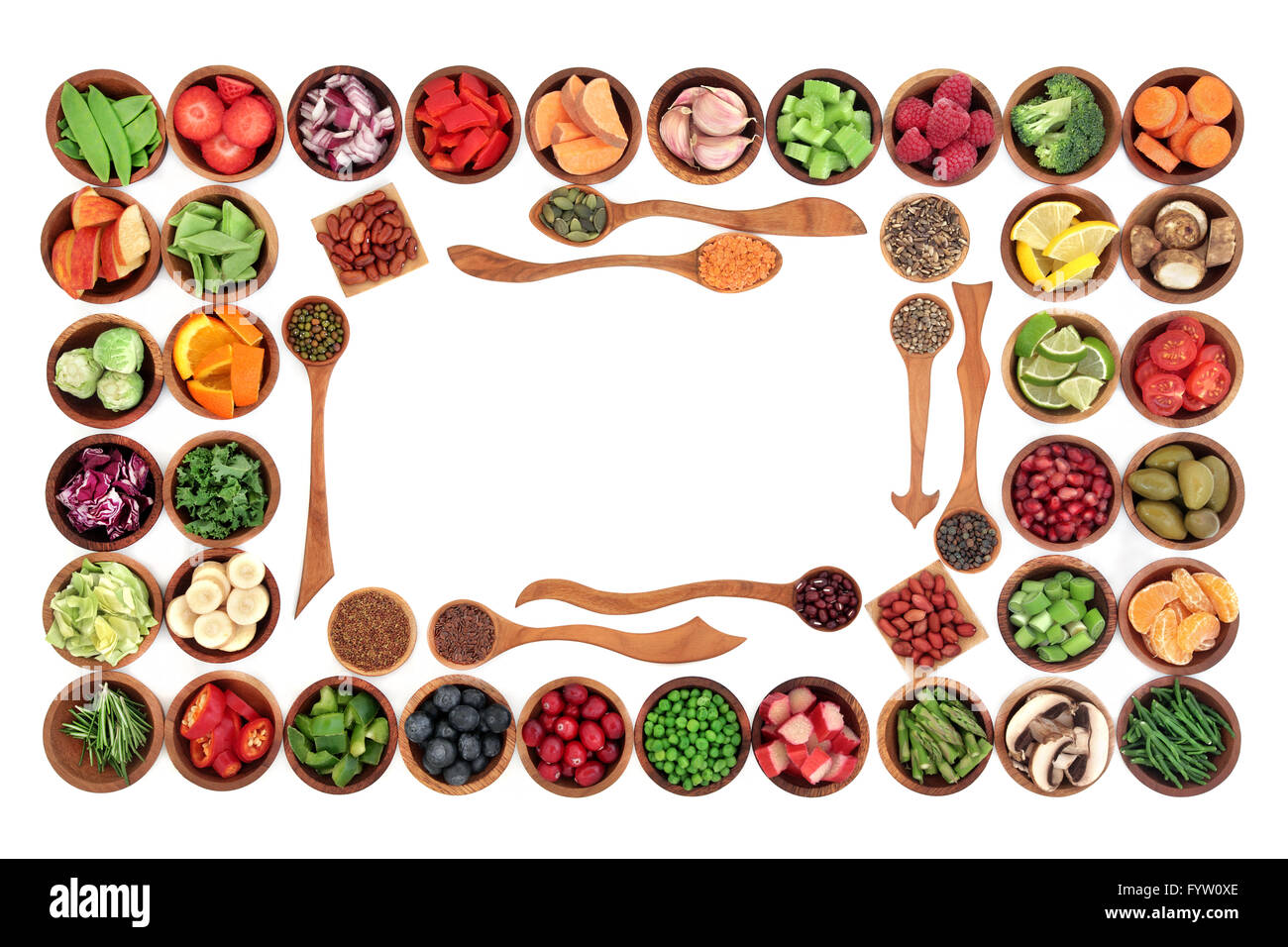 Paleo diet health and super food of fruit, herbs, vegetables, nuts and seeds in wooden bowls