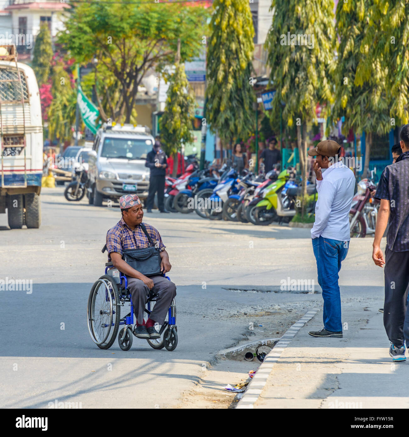 Nepali man in wheelchair on Lakeside in Pokhara, Nepal Stock Photo Alamy