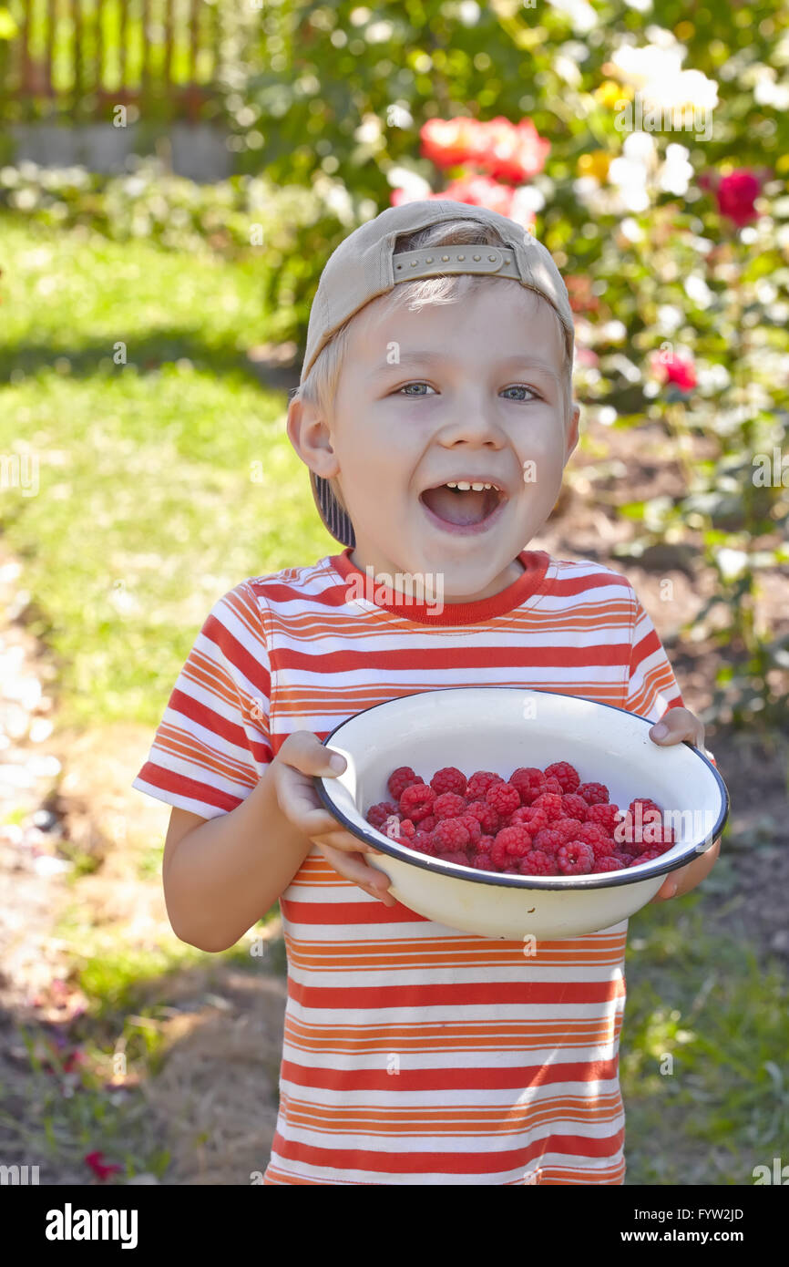 Kid Raspberry Funny kid boy with bowl of a raspberry Stock Photo - Alamy