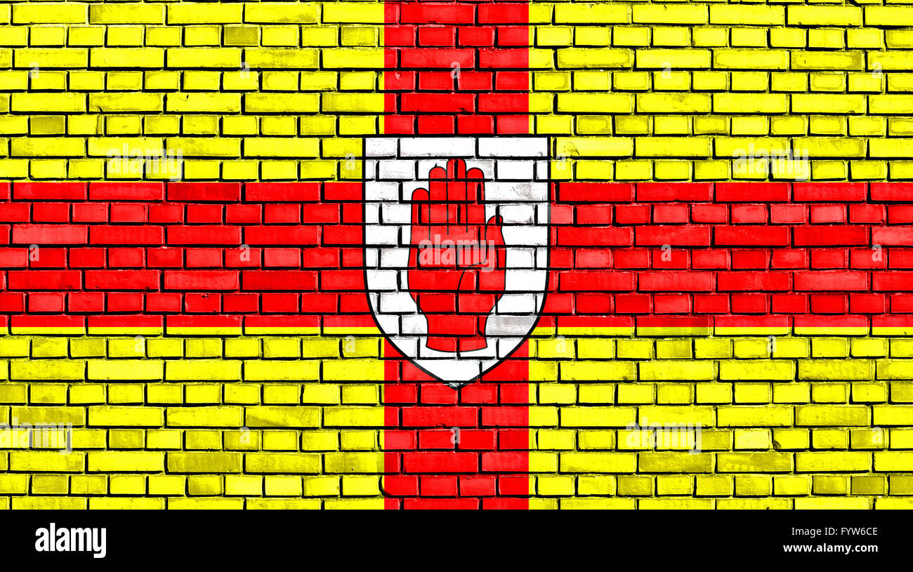 flag of Ulster painted on brick wall Stock Photo