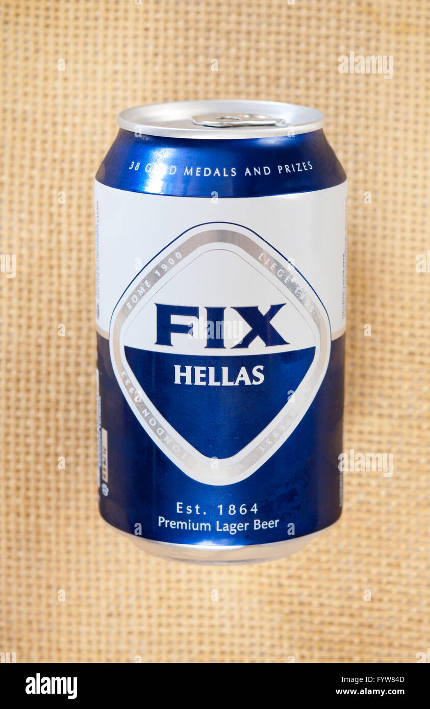 Fix Hellas Greek beer in can, premium lager beer from FIX brewery in Greece, object lying on mat in vertical orientation, nobody Stock Photo