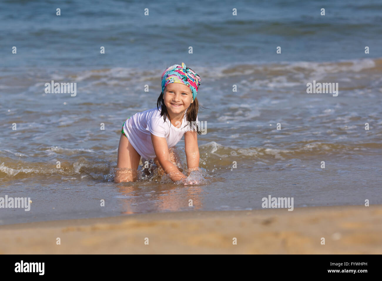 Child playing on the beach Stock Photo - Alamy